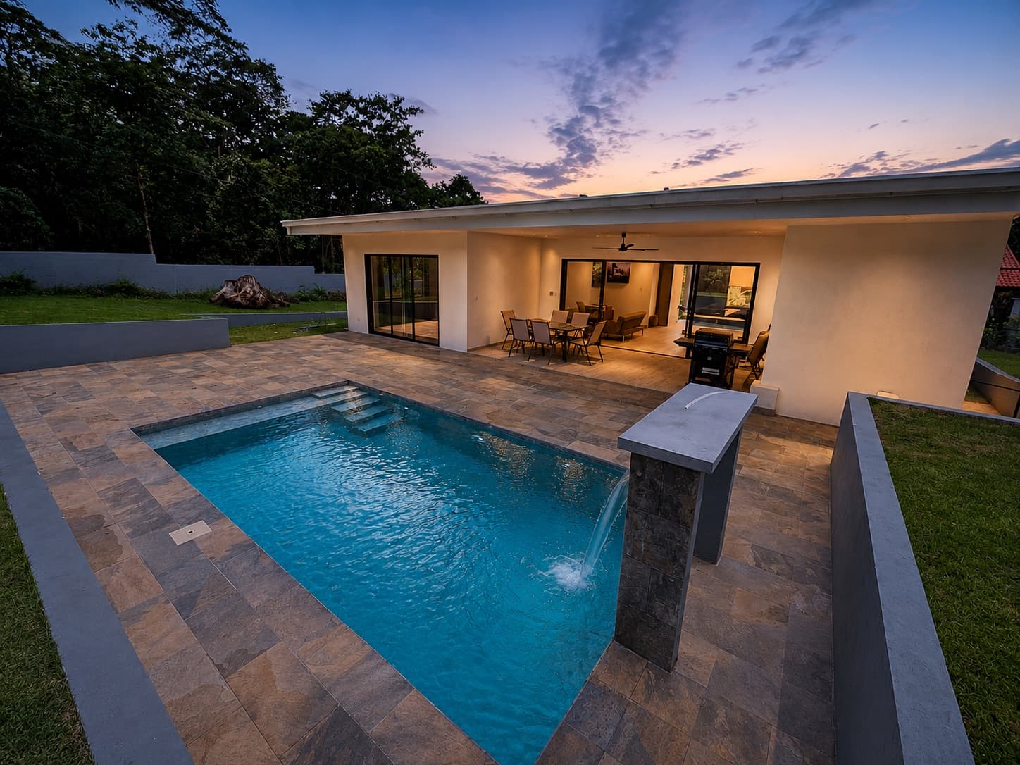 Modern Costa Rica home and pool at dusk